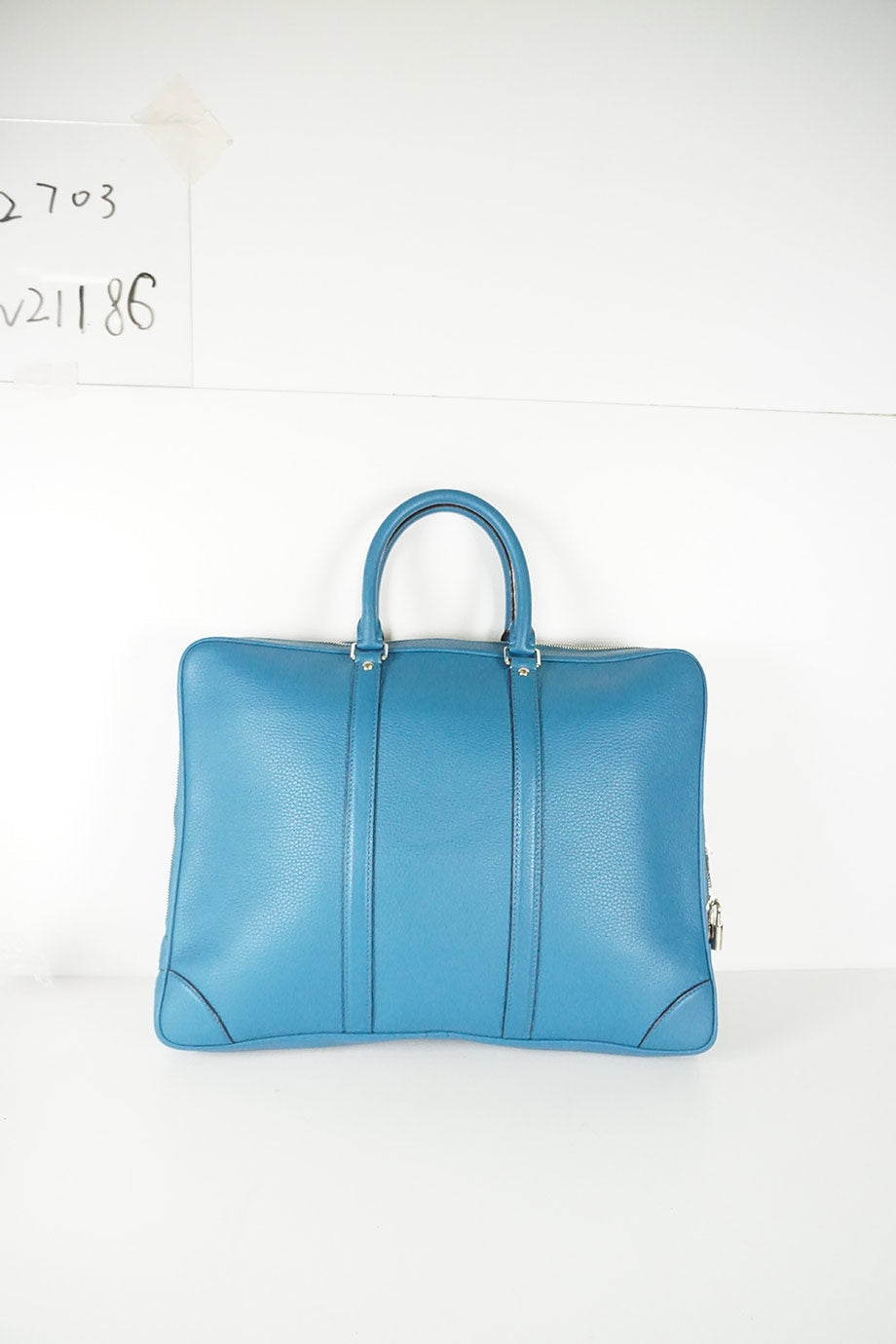 LOUIS VUITTON Indigo blue twin handle zip up briefcase in grained leather.