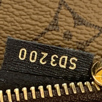 LOUIS VUITTON Metis Pochette Reverse Monogram Canvas Crossbody Bag Brown