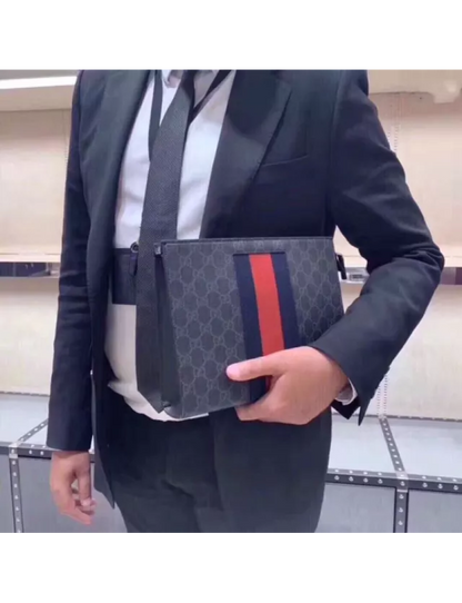 Gucci GG Supreme canvas clutch bag with striped webbing