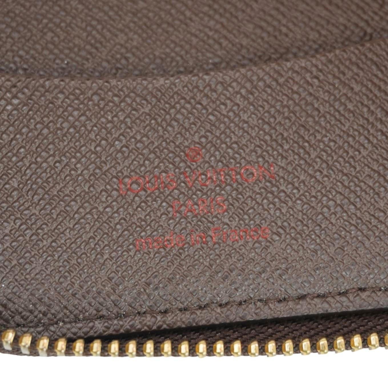 LOUIS VUITTON Zip Around Damier Ebene Wallet Brown