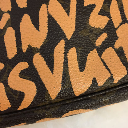 LOUIS VUITTON X Stephen Sprouse Limited Edition Graffiti Pochette Accessorie bag in brown canvas
