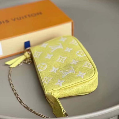 Louis Vuitton LV Women Mini Pochette Accessoires Yellow Monogram Empreinte Embossed Supple Grained Cowhide