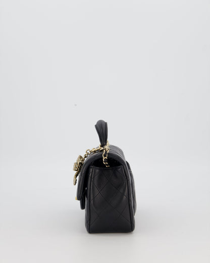 Chanel Black Mini Rectangular Top Handle Flap Bag in Lambskin Leather with Champagne Hardware and Strass Removable Bow Charm