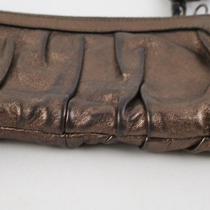 Gucci Metallic Bronze Tassel Pouch