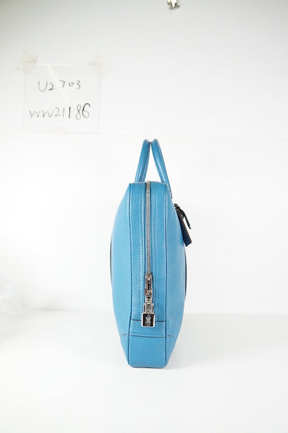 LOUIS VUITTON Indigo blue twin handle zip up briefcase in grained leather.